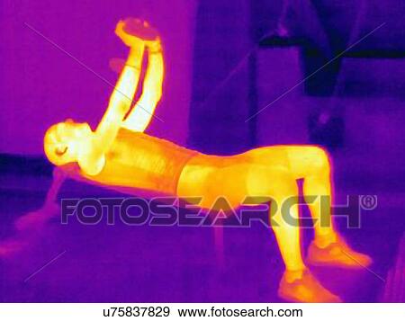 Stock Photo - Thermal image of man training with barbell. The image shows the heat produced by the muscles. Fotosearch