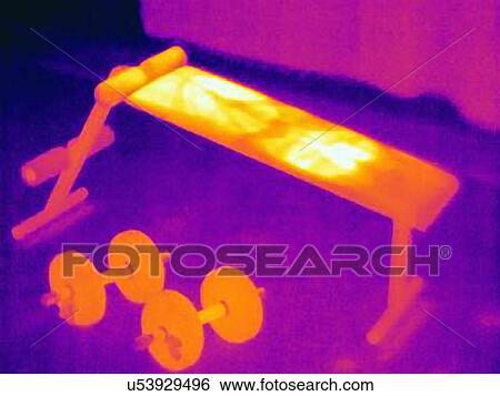 Stock Photograph - Thermal image of weight bench. The image shows the heat left on the bench by the athlete after training. Fotosearch
