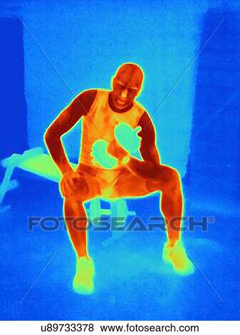 Stock Photo - Thermal image of young male athlete training with weights. The image shows the heat produced by the muscles. Fotosearch