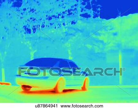 Stock Image - Thermal image which reveals the heat of the tyres and exhaust of a speeding car. Fotosearch