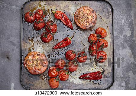 Tray of roasted tomatoes and chillis View Large Photo Image Stock Image - Tray of roasted tomatoes and chillis. Fotosearch