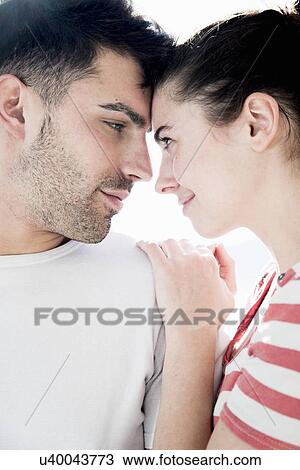 Young couple, forehead to forehead View Large Photo Image Stock Image - Young couple, forehead to forehead. Fotosearch