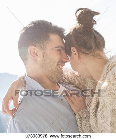 Stock Photo - Young couple hugging. Fotosearch