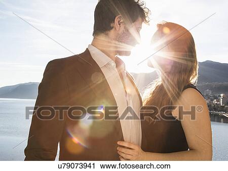 Stock Image - Young couple kissing. Fotosearch