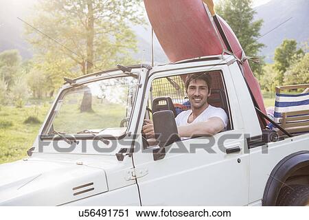 Young man driving off road vehicle View Large Photo Image Stock Image - Young man driving off road vehicle. Fotosearch