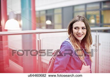 Young woman looking away, smiling View Large Photo Image Stock Image - Young woman looking away, smiling. Fotosearch