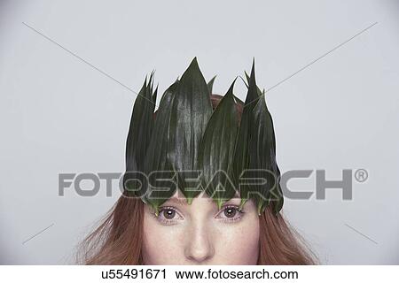 Young woman wearing crown of leaves View Large Photo Image Stock Image - Young woman wearing crown of leaves. Fotosearch