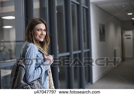 Young woman wearing denim shirt, portrait View Large Photo Image Stock Photo - Young woman wearing denim shirt, portrait. Fotosearch