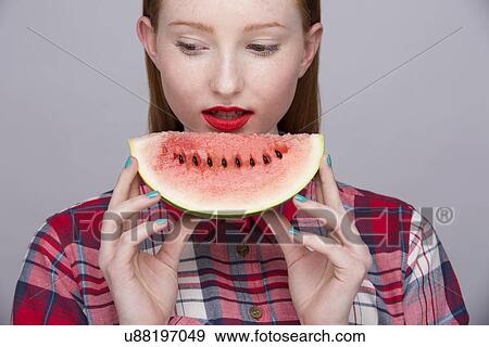 Young woman with slice of watermelon View Large Photo Image Stock Photo - Young woman with slice of watermelon. Fotosearch