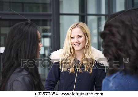 Young women talking View Large Photo Image Picture - Young women talking. Fotosearch