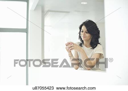 Young women using mp3 player View Large Photo Image Stock Image - Young women using mp3 player. Fotosearch
