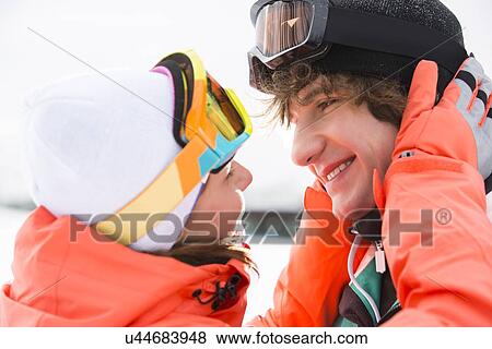 Close-up of romantic young couple about to kiss during winter View Large Photo Image Stock Photo - Close-up of romantic young couple about to kiss during winter. Fotosearch