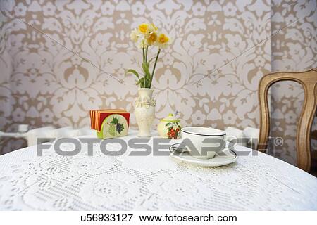 Coffee cup with vase on cafe table View Large Photo Image Stock Photo - Coffee cup with vase on cafe table. Fotosearch