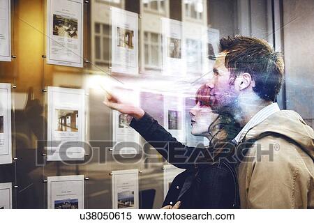 Couple discussing over travel pictures View Large Photo Image Stock Photography - Couple discussing over travel pictures. Fotosearch
