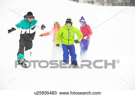 Full length of young friends having fun in snow View Large Photo Image Stock Image - Full length of young friends having fun in snow. Fotosearch