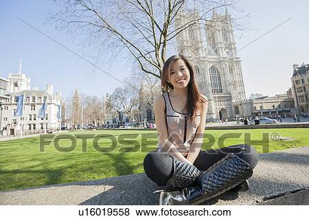 Full length portrait of young woman sitting against Westminster Abbey in London, England, UK View Large Photo Image Stock Photo - Full length portrait of young woman sitting against Westminster Abbey in London, England, UK. Fotosearch