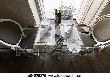 High angle view of arranged table in restaurant View Large Photo Image Stock Photograph - High angle view of arranged table in restaurant. Fotosearch