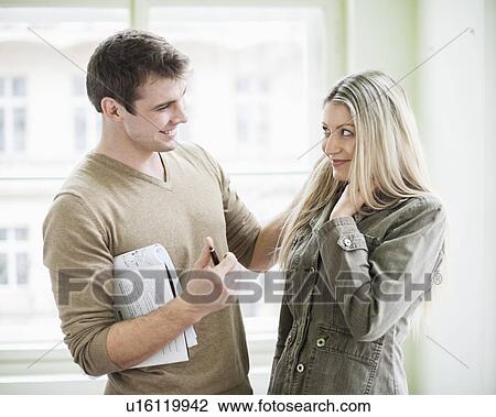 Loving business couple looking at each other in office View Large Photo Image Stock Image - Loving business couple looking at each other in office. Fotosearch