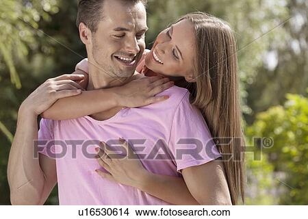 Loving young couple spending quality time in park View Large Photo Image Picture - Loving young couple spending quality time in park. Fotosearch