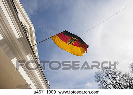 Low angle view of German flag on government building against cloudy sky, Tallinn, Estonia, Europe View Large Photo Image Stock Photo - Low angle view of German flag on government building against cloudy sky, Tallinn, Estonia, Europe. Fotosearch
