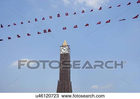 Stock Image - Low angle view of place du 7 November 1987 clock tower, Avenue Habib Bourguiba, Tunis, Tunisia. Fotosearch