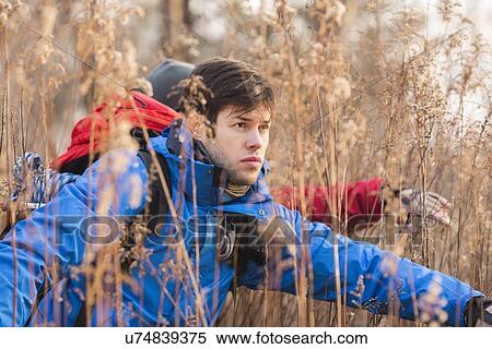 Male hikers in field View Large Photo Image Stock Photography - Male hikers in field. Fotosearch
