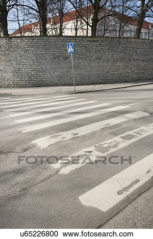 Stock Image - Pedestrian crossing sign on empty street, Tallinn, Estonia, Europe. Fotosearch
