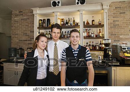 Portrait of confident waitstaff in restaurant View Large Photo Image Stock Image - Portrait of confident waitstaff in restaurant. Fotosearch