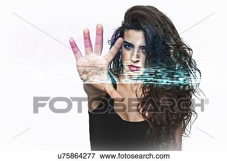 Portrait of confident young woman gesturing stop sign over white background View Large Photo Image Stock Photo - Portrait of confident young woman gesturing stop sign over white background. Fotosearch
