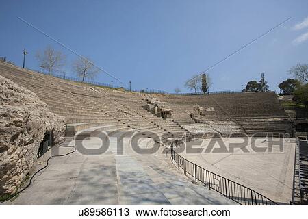 Roman amphitheater against blue sky, Tunis, Tunisia View Large Photo Image Stock Image - Roman amphitheater against blue sky, Tunis, Tunisia. Fotosearch