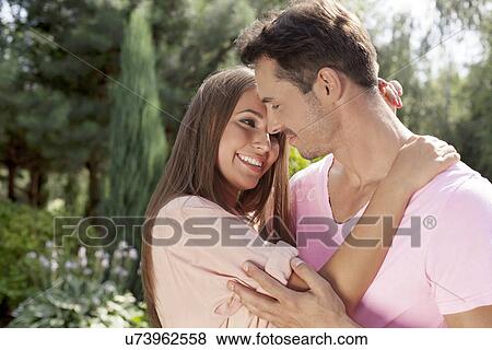 Romantic young couple in park View Large Photo Image Stock Photo - Romantic young couple in park. Fotosearch