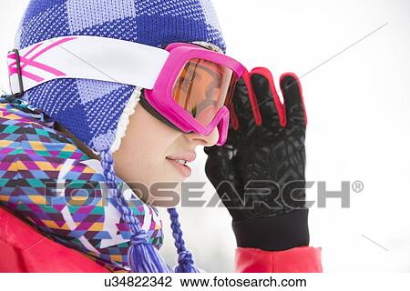 Side view close-up of beautiful young woman in ski goggles looking away View Large Photo Image Stock Image - Side view close-up of beautiful young woman in ski goggles looking away. Fotosearch