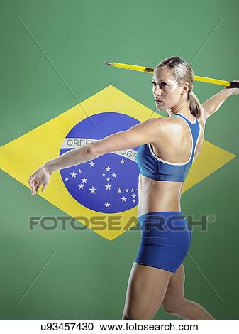 Side view of female athlete throwing javelin against Brazilian flag View Large Photo Image Stock Image - Side view of female athlete throwing javelin against Brazilian flag. Fotosearch