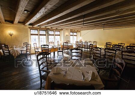 Tables and chairs arranged in restaurant View Large Photo Image Stock Photograph - Tables and chairs arranged in restaurant. Fotosearch