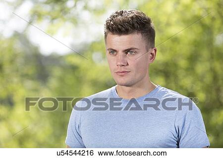 Stock Photograph - Thoughtful fit man in park. Fotosearch