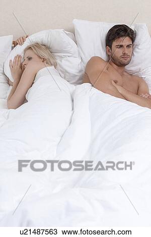 Young couple having relationship difficulties in hotel room View Large Photo Image Stock Image - Young couple having relationship difficulties in hotel room. Fotosearch