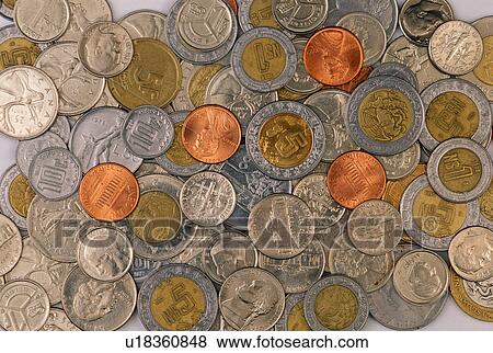 Stock Photo - Stock photo of a mixture of American and foreign coins. Fotosearch