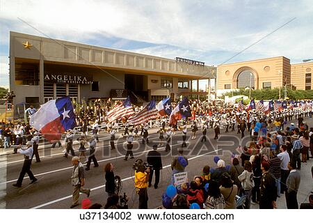 Stock Image - Stock photo of a parade through the theater district in downtown Houston Texas. Fotosearch