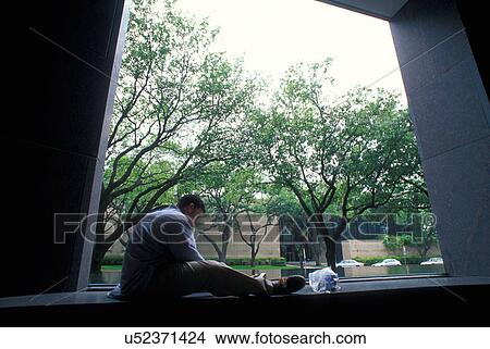 Stock photo of a student reading on campus View Large Photo Image Picture - Stock photo of a student reading on campus. Fotosearch