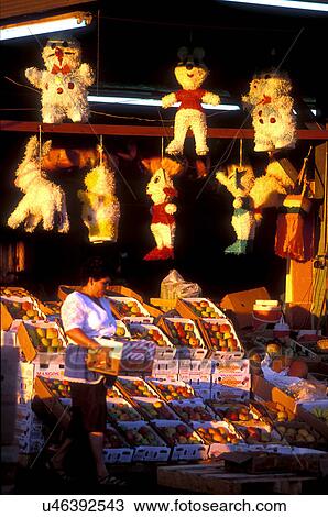 Stock photo of a woman selling mango and pinatas at the farmer's market in Houston Texas View Large Photo Image Stock Image - Stock photo of a woman selling mango and pinatas at the farmer's market in Houston Texas. Fotosearch
