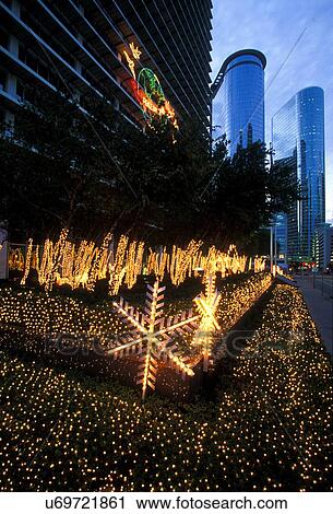 Stock photo of Christmas lights decorating the landscaping outside of a downtown Houston office building View Large Photo Image Stock Image - Stock photo of Christmas lights decorating the landscaping outside of a downtown Houston office building. Fotosearch