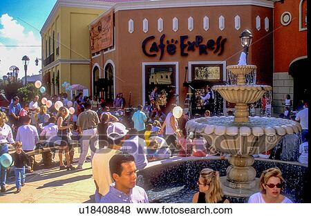 Stock Photo - Stock photo of many people outside of Cafe Express and the plaza on a sunny afternoon. Fotosearch