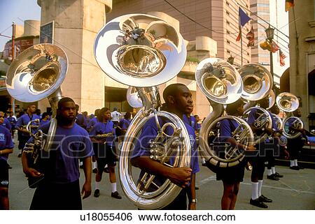Stock Photograph - Stock photo of members of a marching band with tubas participating in a downtown Houston parade.. Fotosearch