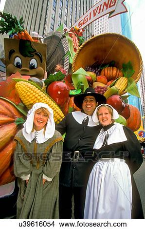Stock photo of participants dressed as pilgrims in the Thanksgiving Day parade making its way through downtown Houston Texas View Large Photo Image Picture - Stock photo of participants dressed as pilgrims in the Thanksgiving Day parade making its way through downtown Houston Texas. Fotosearch