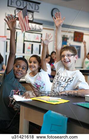 Stock Photo - Stock photo of students answering questions in class at Lovett Elementary School in Houston Texas. Fotosearch