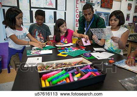 Stock Image - Stock photo of young students participating in art class at Lovett Elementary School in Houston Texas. Fotosearch