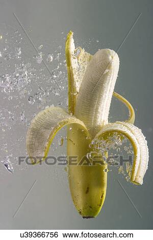 Banana in water View Large Photo Image Stock Photograph - Banana in water . Fotosearch