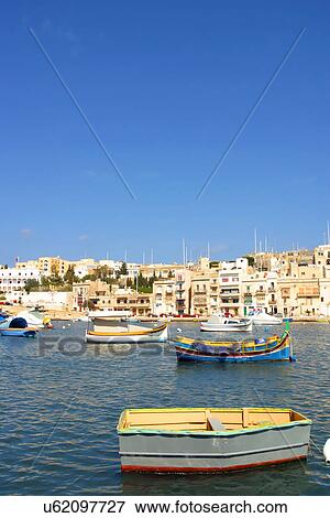 Boats floating in the water View Large Photo Image Stock Photo - Boats floating in the water. Fotosearch