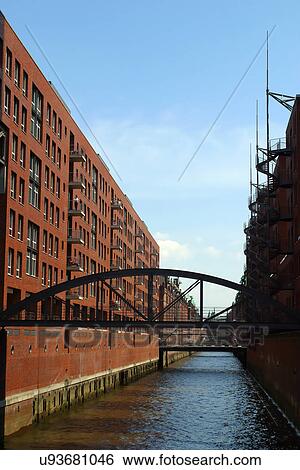 Bridge in a city over water View Large Photo Image Stock Photograph - Bridge in a city over water . Fotosearch