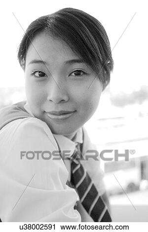 Business woman looking at camera View Large Photo Image Stock Image - Business woman looking at camera. Fotosearch